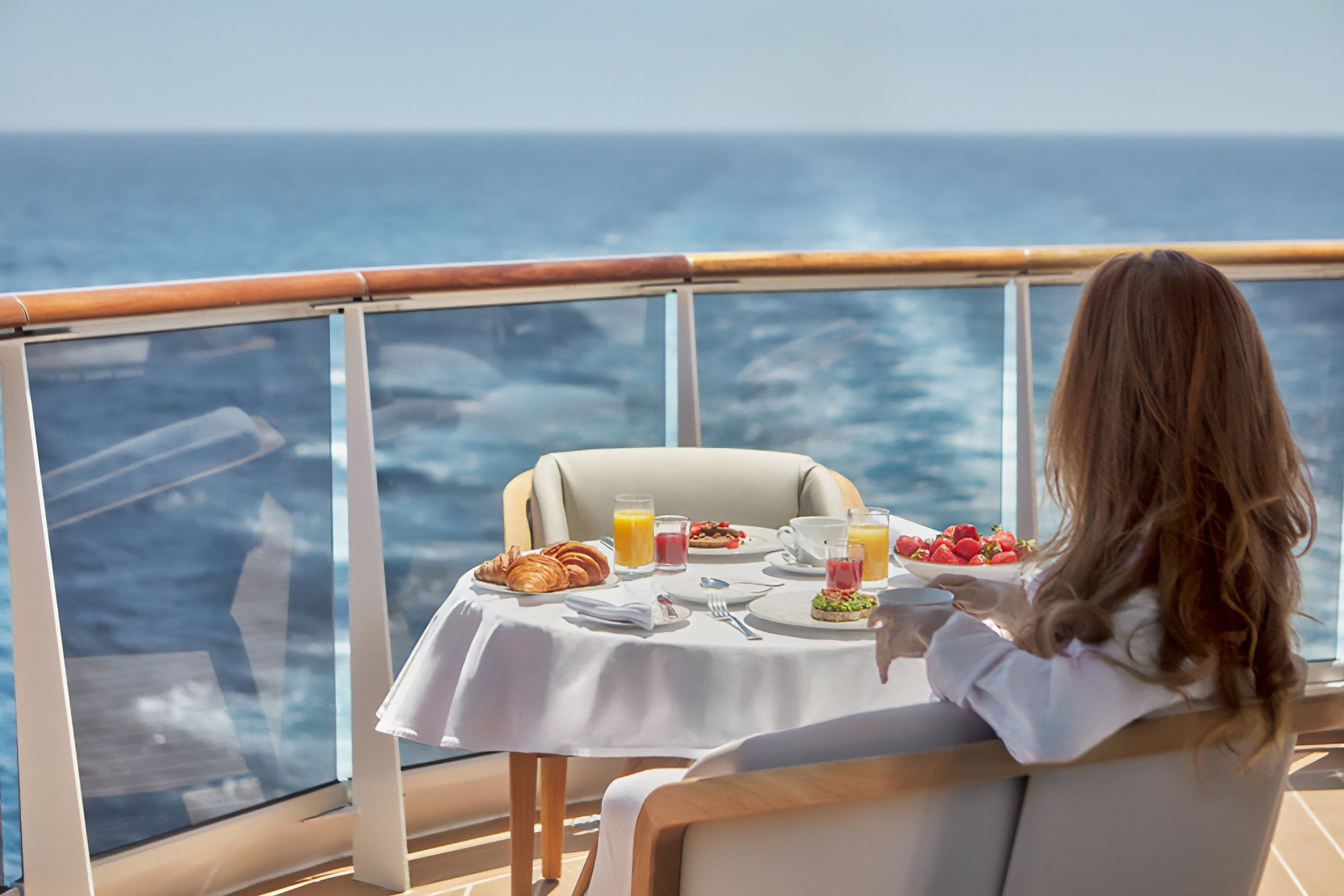 Explora_Suite-Balcony-Woman-SQ2